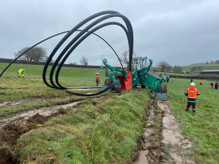 Cable plough workers on site